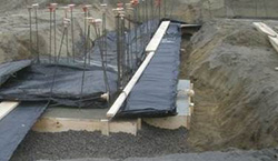 concrete blankets used during pouring of foundation footing in winter